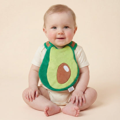 baby wearing avocado-shaped drool bib, neutral aesthetic handmade bib
