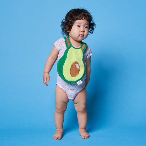 Bib-A-Deez Avocado Drool Bib worn by standing baby
