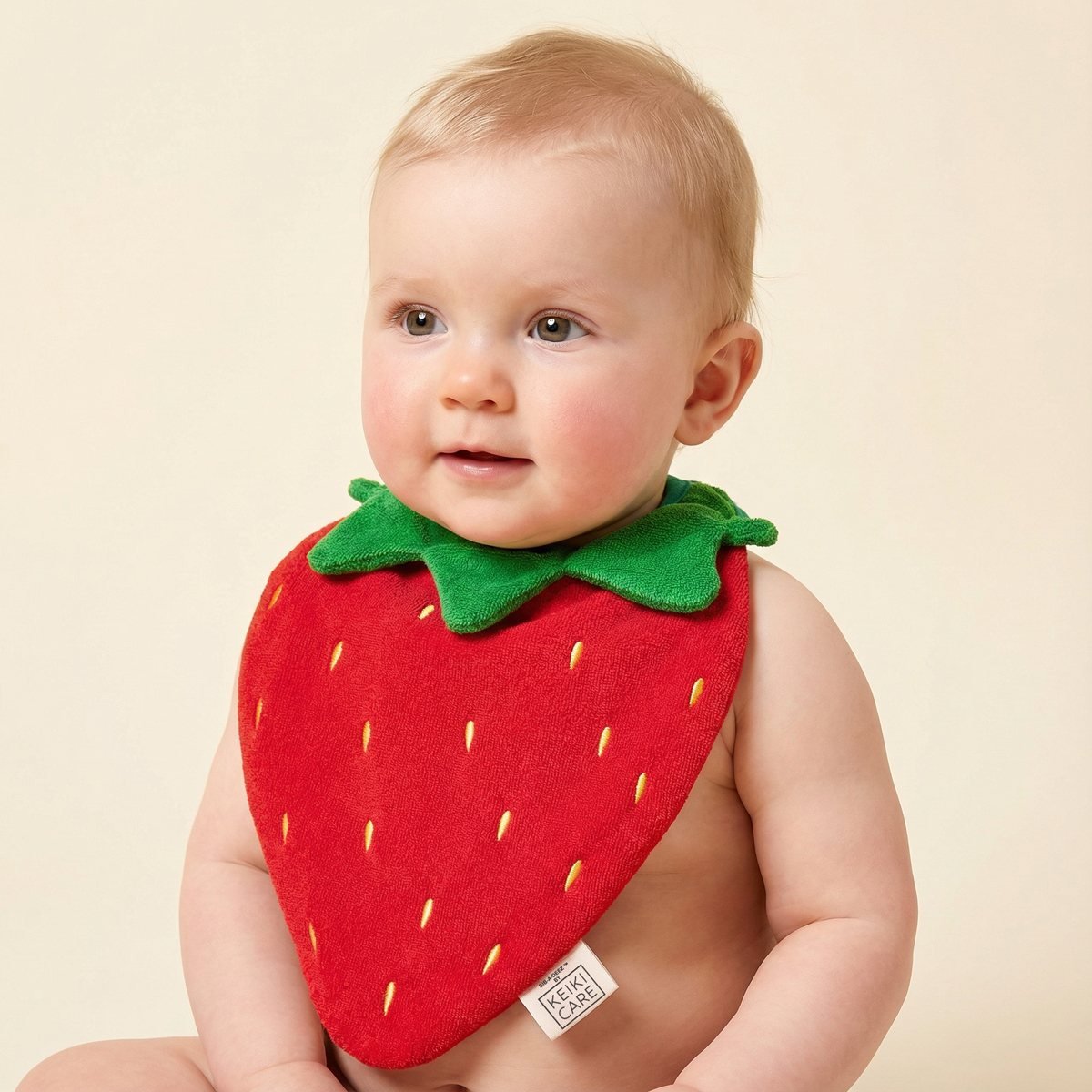 baby wearing handmade strawberry-shaped drool bib, soft cotton, adorable fruit bib