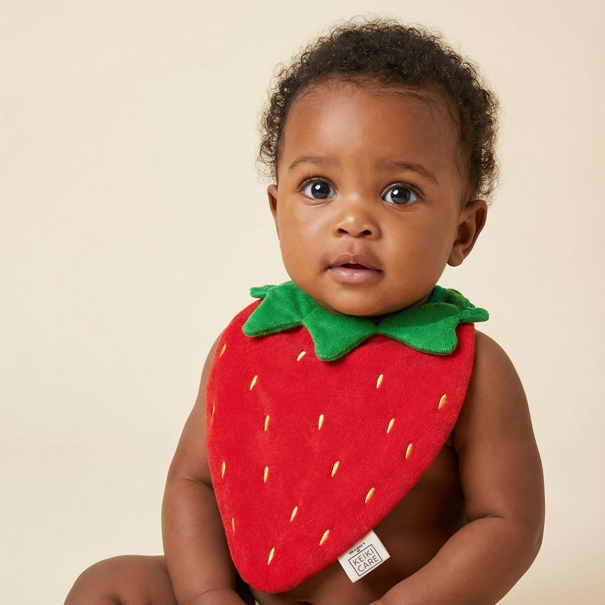 baby wearing handmade strawberry-shaped drool bib, soft cotton, adorable fruit bib